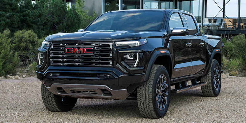 Black GMC Canyon pickup truck parked outdoors.
